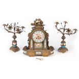 A LATE 19TH CENTURY FRENCH SEVRES STYLE ORMOLU AND PORCELAIN PANELLED CLOCK GARNITURE the case