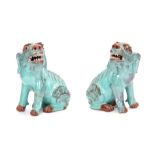 A PAIR OF CHINESE PALE BLUE GLAZED TERRACOTTA SEATED DOGS OF FO 17.5cm high