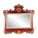 AN EARLY 19TH CENTURY MAHOGANY AND CARVED GILT WORK OVERMANTEL MIRROR with rococo style carved