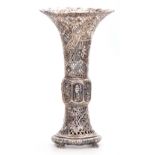 A LARGE 19TH CENTURY CHINESE PIERCED SILVER VASE of trumpet form having relief work scenes of