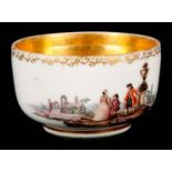 AN 18TH CENTURY MEISSEN SMALL BOWL with gilded interior and finely painted opposing views of