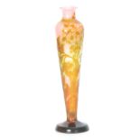 A STYLISH GALLE FOOTED SLENDER TAPERING SHOULDERED VASE the fire polished body with reliefwork