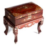 A 19TH CENTURY ORIENTAL MOTHER OF PEARL INLAID ROSEWOOD BOX ON STAND with cushion-shaped lid