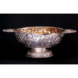 A 17TH/18TH CENTURY SILVER DUTCH BRANDY BOWL with Rococo work decoration and pierced cherub head