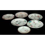THREE 18TH CENTURY CHINESE EXPORT PLATES decorated in enamel colours with chrysanthemum and
