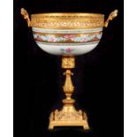 A 19TH CENTURY FRENCH SERVES PORCELAIN ORMOLU MOUNTED CUP with pierced brass rim fitted with