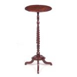 A WILLIAM AND MARY BURR OAK CANDLESTAND with moulded burr top above a barley twist stem and platform