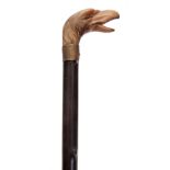 A 19TH CENTURY GENTLEMANS RHINO HORN HANDLED WALKING CANE the handle modelled as a birds head with