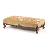 A 19TH CENTURY ROSEWOOD FOOTSTOOL WITH BEADWORK UPHOLSTERED TOP the frame with pierced fretwork