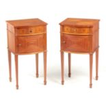 A PAIR OF EDWARDIAN SATINWOOD BOW-FRONT BEDSIDE CABINETS with ebony inlaid stringing and frieze