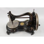 Jones Cat Back Hand Sewing Machine of Black Tole and Gilding. Condition - Some Loss to Gilding