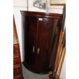 19thC Barrel front 2 Door Mahogany wall cabinet with exposed brass hinges