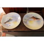 Pair of Limoge hand Painted chargers depicting fish signed Planchet, 31cm in Diameter