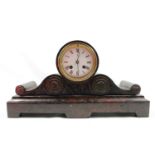 French Red marble Drumhead mantel clock striking on a bell, within a stepped scrolling case,