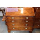 19thC Walnut Fall front bureau of 4 drawers with Oval Brass drop handles and bracket feet, 106cm