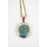 High Quality Oval Black Opal and Diamond Pendant on 18ct Gold mount and chain
