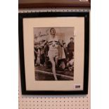Personally signed by Roger Bannister a 4 minute mile photograph as he crosses the line. Framed and