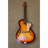 1960s Sunburst Acoustic Guitar with pierced F holes and pearlescent pick guard