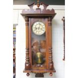 Becker wall clock in Walnut case with roman numeral dial