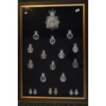 Framed collection of Police Cap Badges inc. Metropolitan, Cheshire, Shropshire etc
