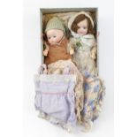 2 Small German Bisque headed dolls with assorted clothing