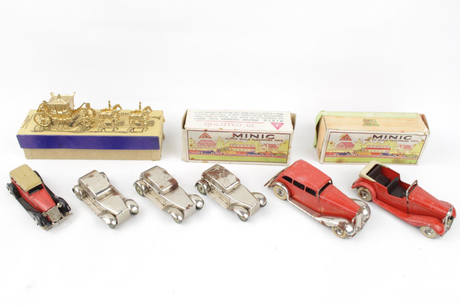 2 Boxed Tri-Ang Minic wind up cars, Boxed Britains Minature Gilt Coronation Coach and a small qty.