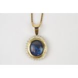 High Quality Oval Black Opal and Diamond Pendant on 18ct Gold mount and chain, The Oval Black
