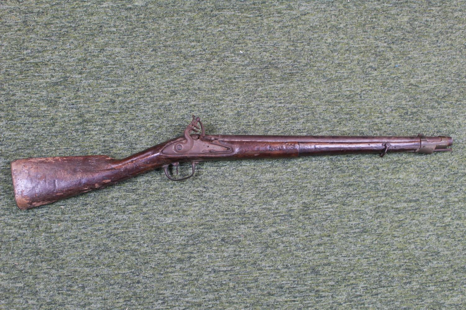 Late 18thC European Flintlock rifle with Brass and Ironwork fittings with Walnut Butt, and Ramrod.