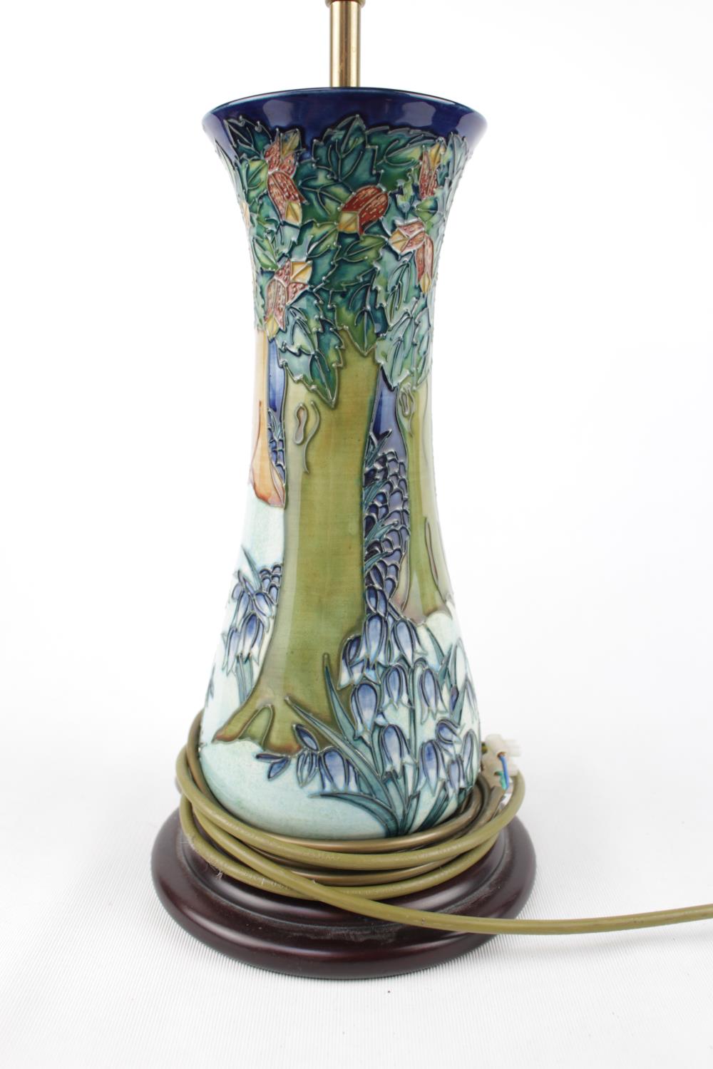 Large Moorcroft table lamp with shade, of Forrest design and wooden base. 68cm in Height