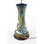 Large Moorcroft table lamp with shade, of Forrest design and wooden base. 68cm in Height