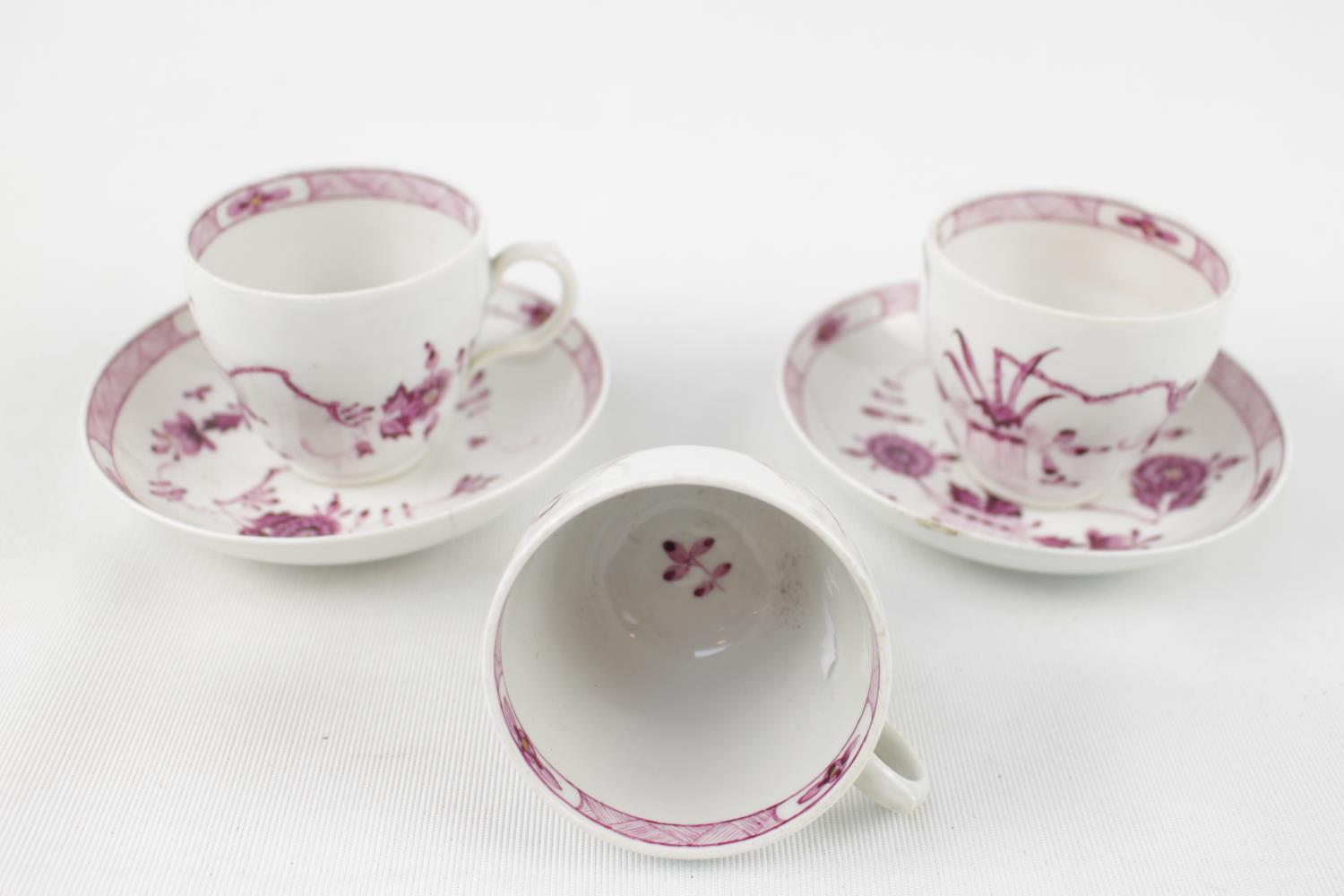 Pair of Early Copenhagen Cups and Saucers of Floral design and another cup C.1880