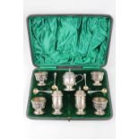 George V seven piece silver cruet set by Walker & Hall Birmingham 1918, housed in a velvet and