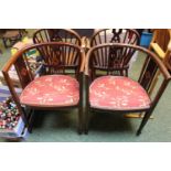 Pair of Edwardian Walnut Inlaid Tub Chairs with upholstered seats over tapering legs