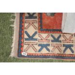 Large Red ground Asian Rug with floral and geometric design
