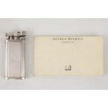 Alfred Dunhill Silver plated pocket lighter of engine turned form with matching booklet WF30315