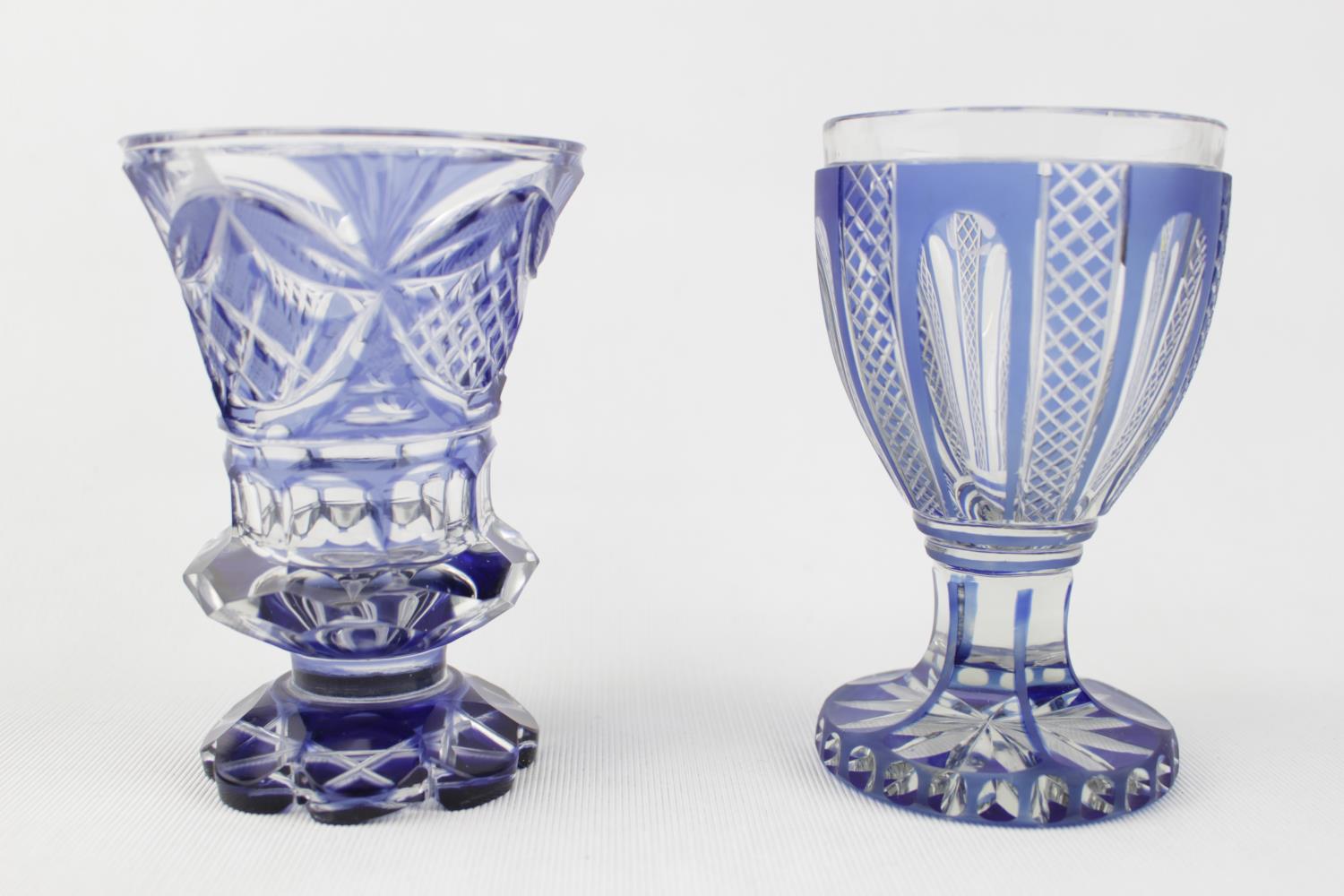 TWO 19TH CENTURY BOHEMIAN SPA GLASSES, blue flashed and cut, one with flared trumpet bowl on lobed