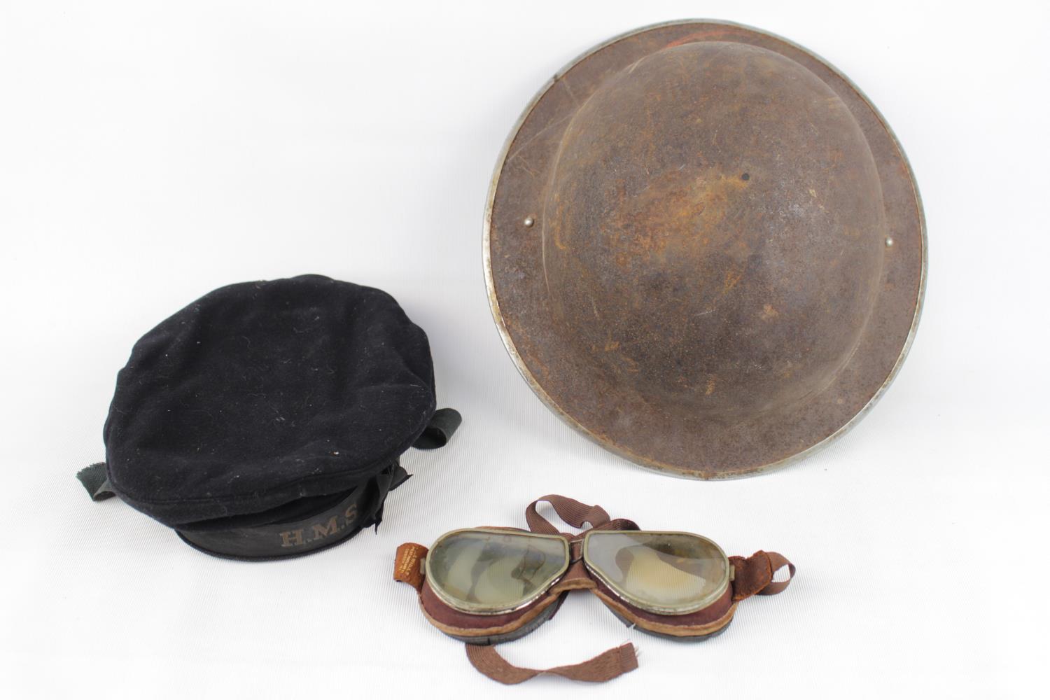 WW1 Tommy Helmet, RAF Flight Googles and a Naval Cap marked HMS