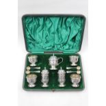 George V seven piece silver cruet set by Walker & Hall Birmingham 1918, housed in a velvet and