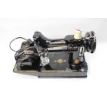 A SINGER "S1 221K" ELECTRIC SEWING MACHINE with original case