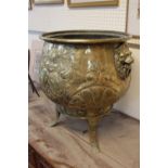 Very Large Victorian Cauldron shaped Brass embossed Log cucket on Tripod support, with Lions head
