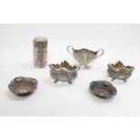 Collection of White metal highly foliate decorated Silver ware inc. Perfume bottle holder, Cruets