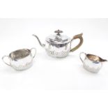 Victorian oval half fluted bachelors tea set of fluted form, London 1886. 496g total weight