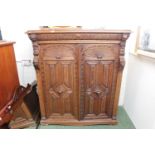 Large 19thC Carved Oak Continental 2 door cabinet with figural pillars