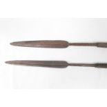 Pair of Ashanti War Spears of hand forged form with wooden shafts 148cm in Length