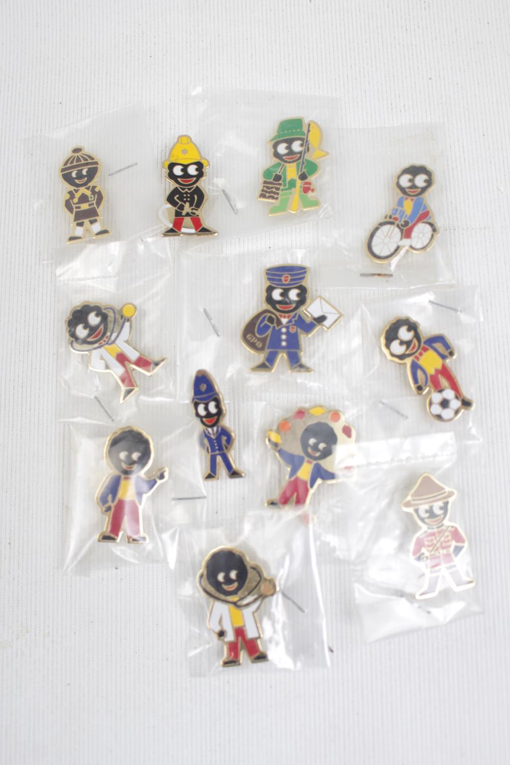 Collection of Robinson's golly pin badges