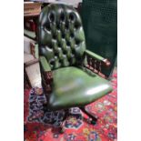 20thC Green Leather button back Chesterfield Oval backed swivel chair with turned supports
