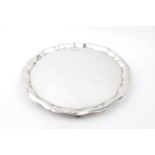 Silver Salver with shaped edge supported on scroll feet 19.5cm in Diameter by Emile Viner, Sheffield