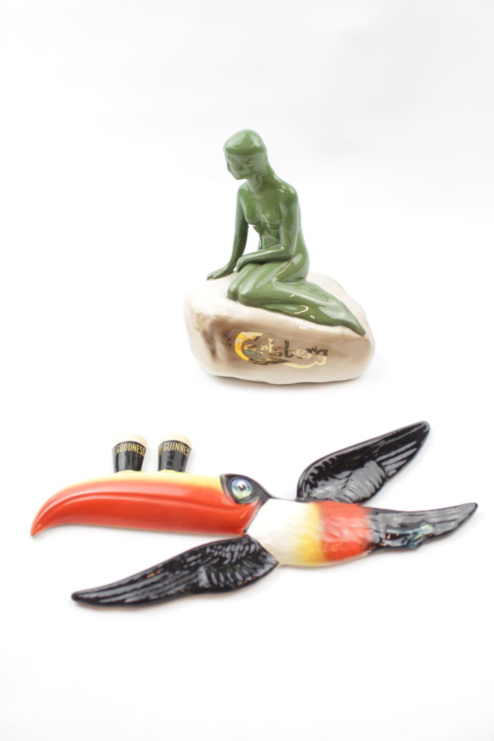 Guinness Carltonware Wall sconce Toucan and a Carlsberg Porcelain nude on a rock