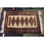 Cream Ground rug with floral border 105 x 64cm
