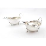 Pair of George V Silver Sauce Boats of Georgian design on pad feet and scroll handle, Birmingham